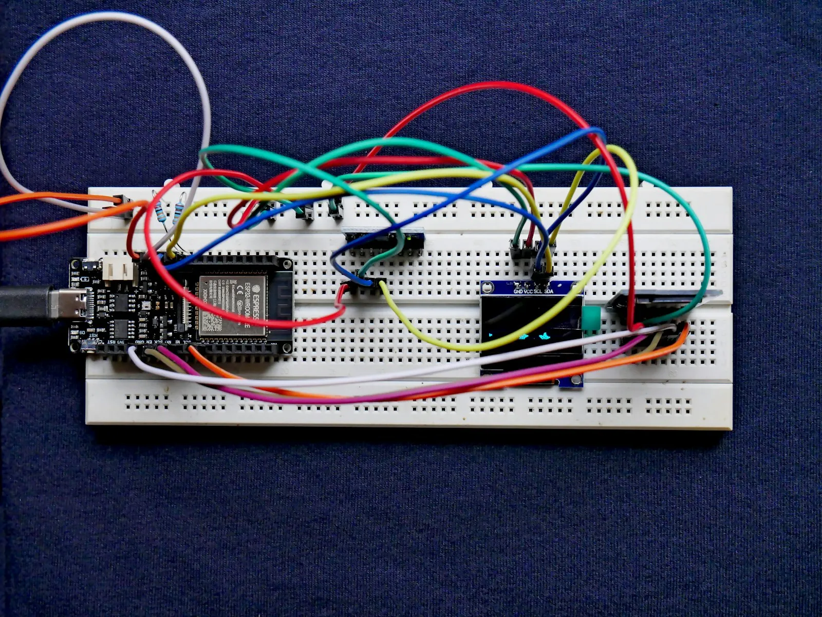 An ESP32 prototype on a breadboard with jumper wires